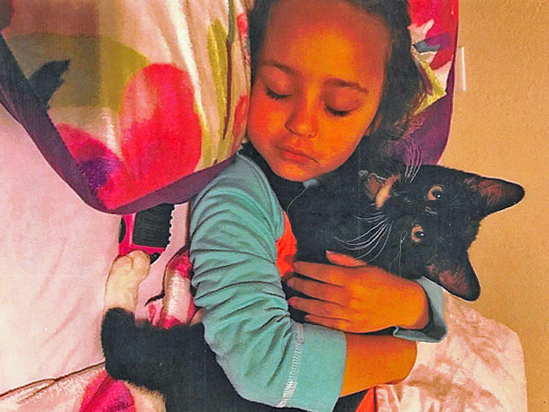 Black Cat and Young Child Sleeping